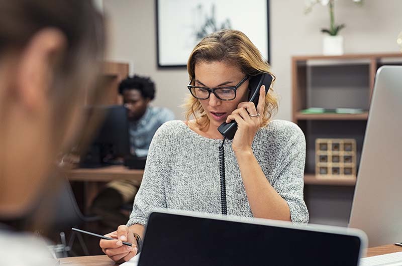 Customer Service Representative on Phone with Customer